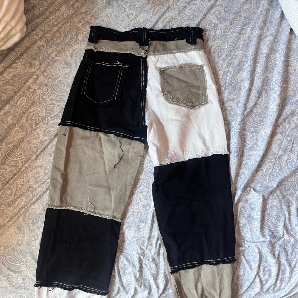 Black and white patchwork jeans with a unique design
